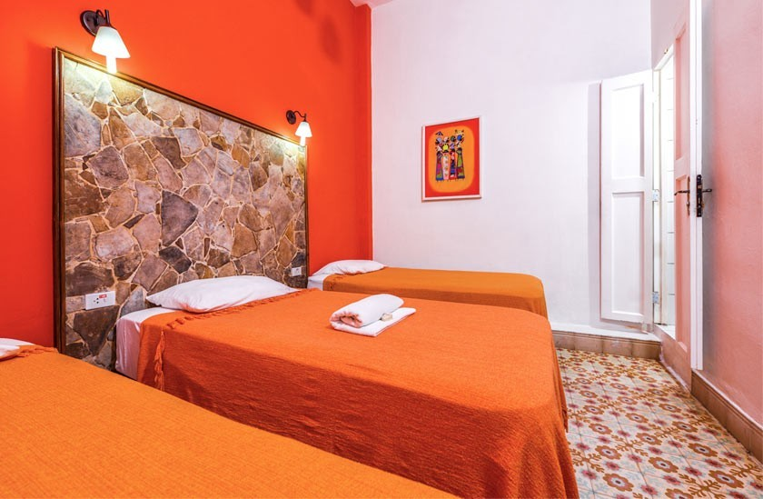 The Orange room in La Gargola Hostal, Havana, Cuba