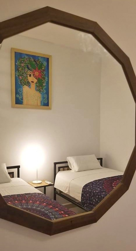 Polygonal bedroom mirror in Havana guesthouse