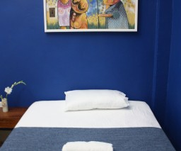 The blue room features paintings from local Cuban artists. The Blue room in the Gargola casa in Old Havana, Cuba